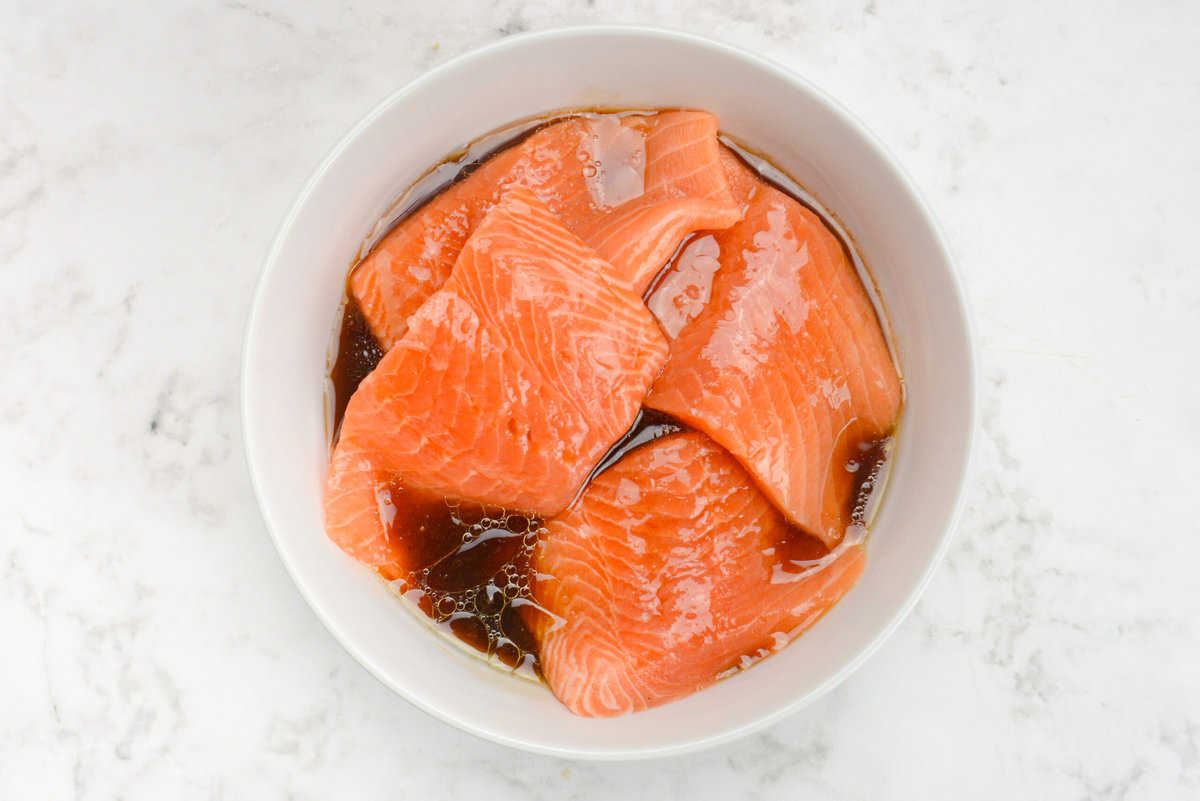 raw salmon filets marinating