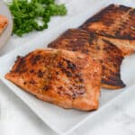 blackstone salmon sitting on a white plate.