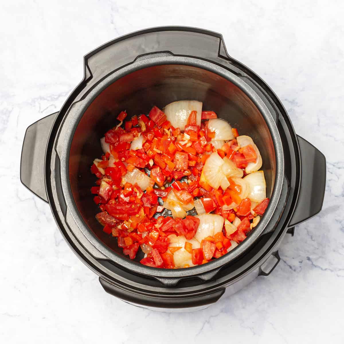 diced onion, minced garlic, diced tomatoes, and diced red bell pepper in instant pot