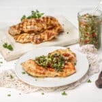 Chicken Chimichurri served on table in a plate and tray