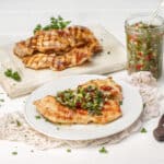 Chicken Chimichurri served on table in a plate and tray