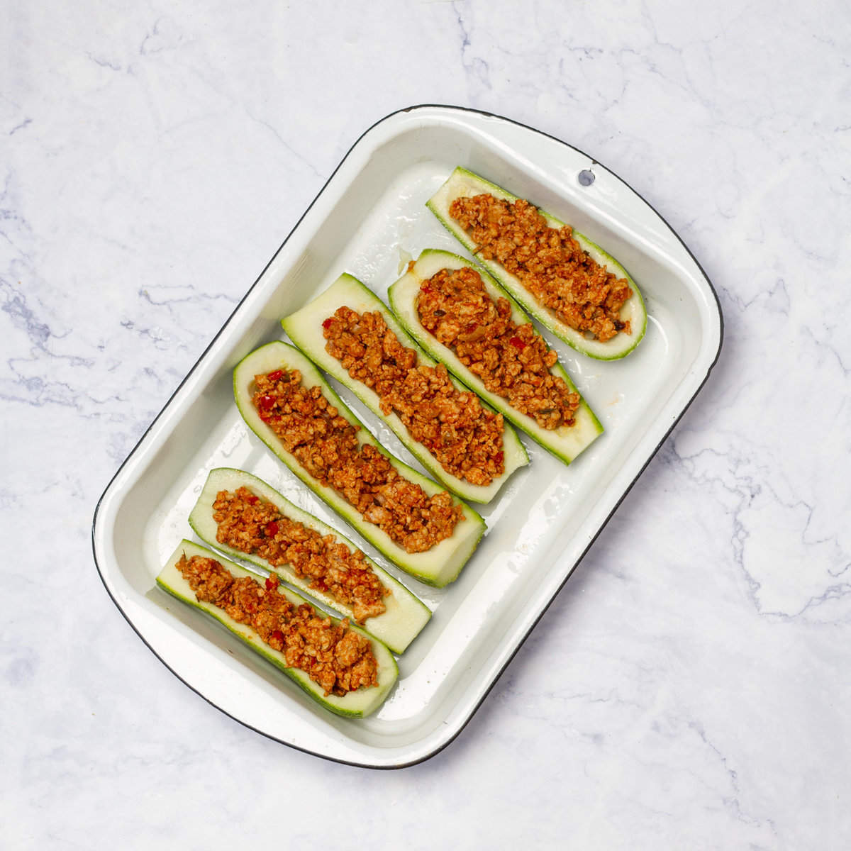 Fill each Zucchini boat with the ground chicken mixture