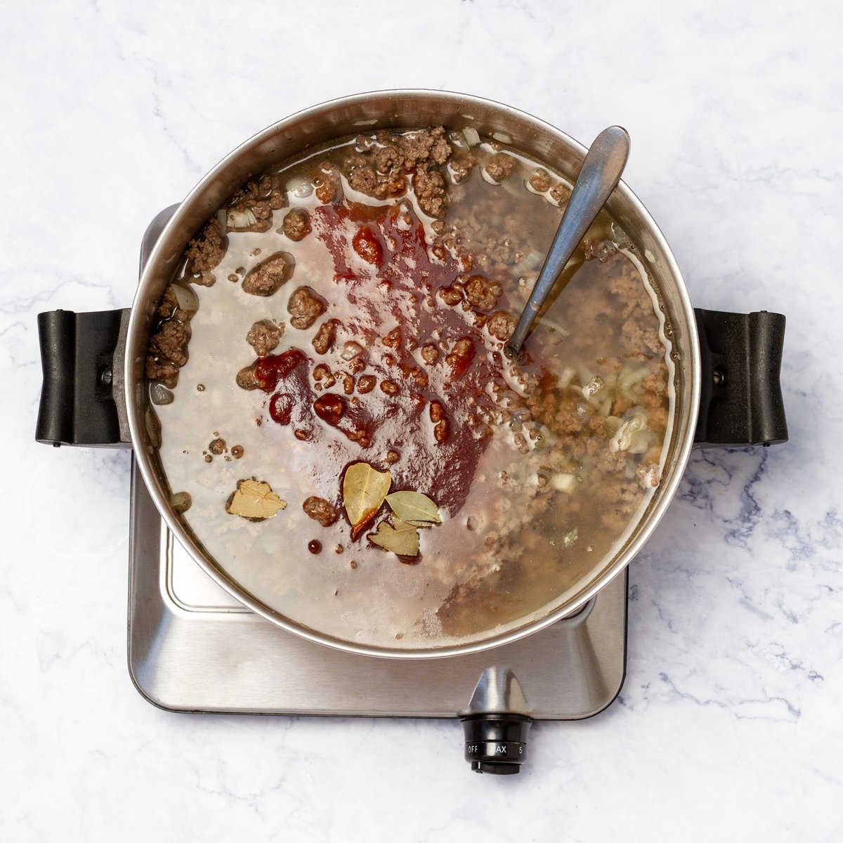 ground beef cooking in beef broth