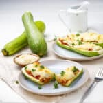 Zucchini Boats served in plates with Zucchini