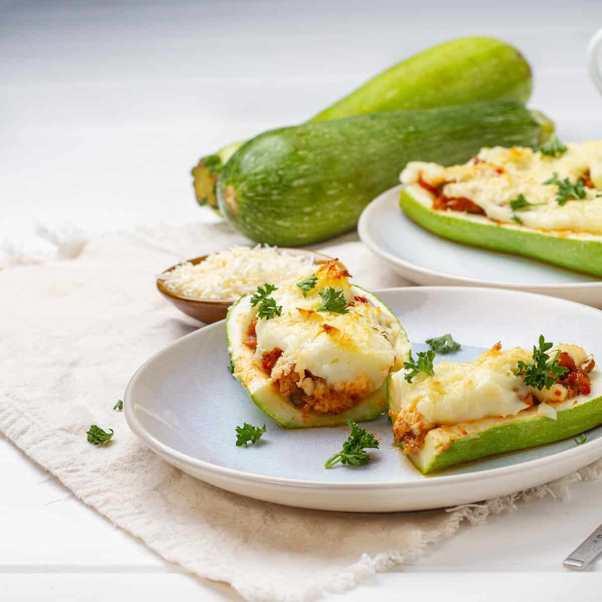 Zucchini Boats served in plates with Zucchini