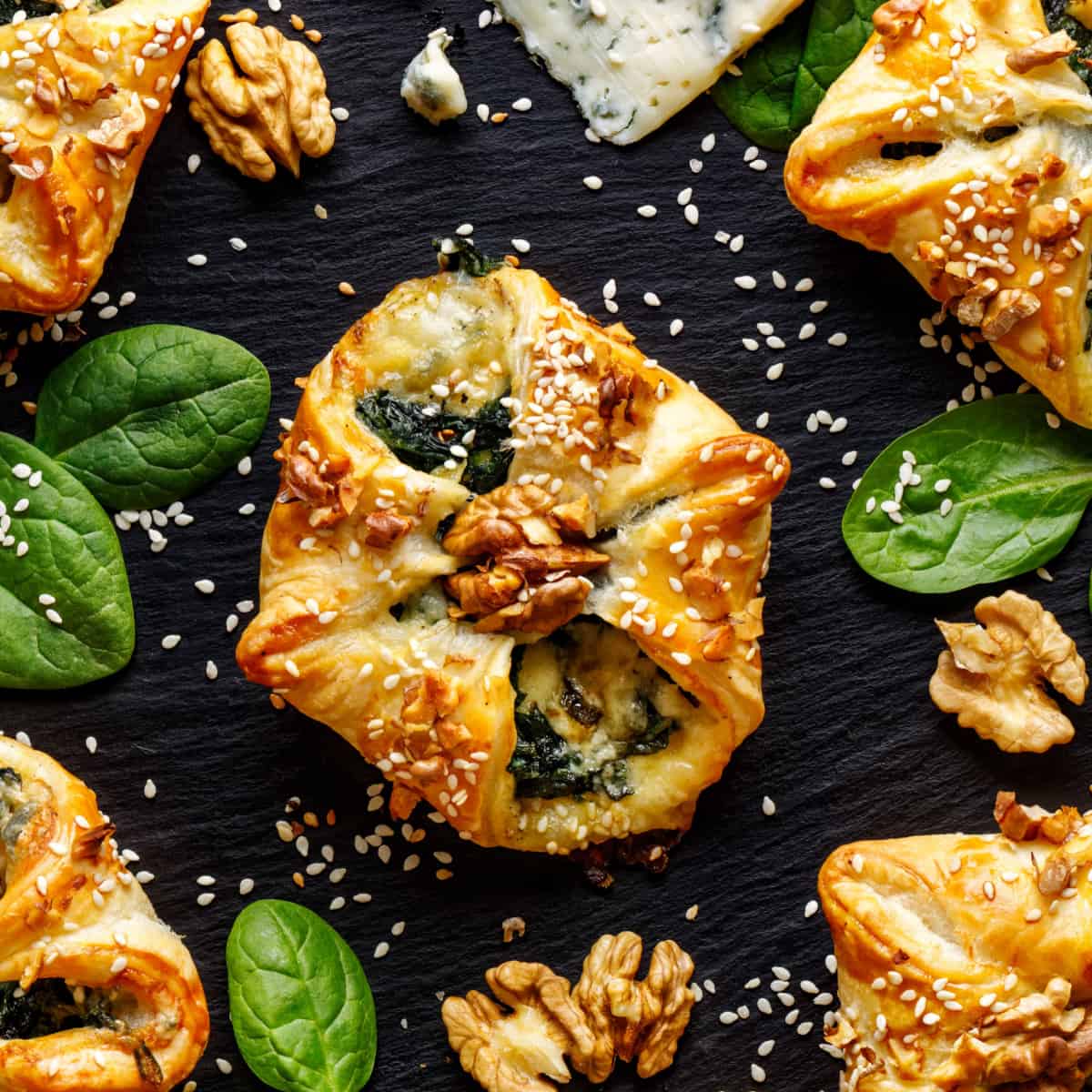 spinach puff pastry on black tray