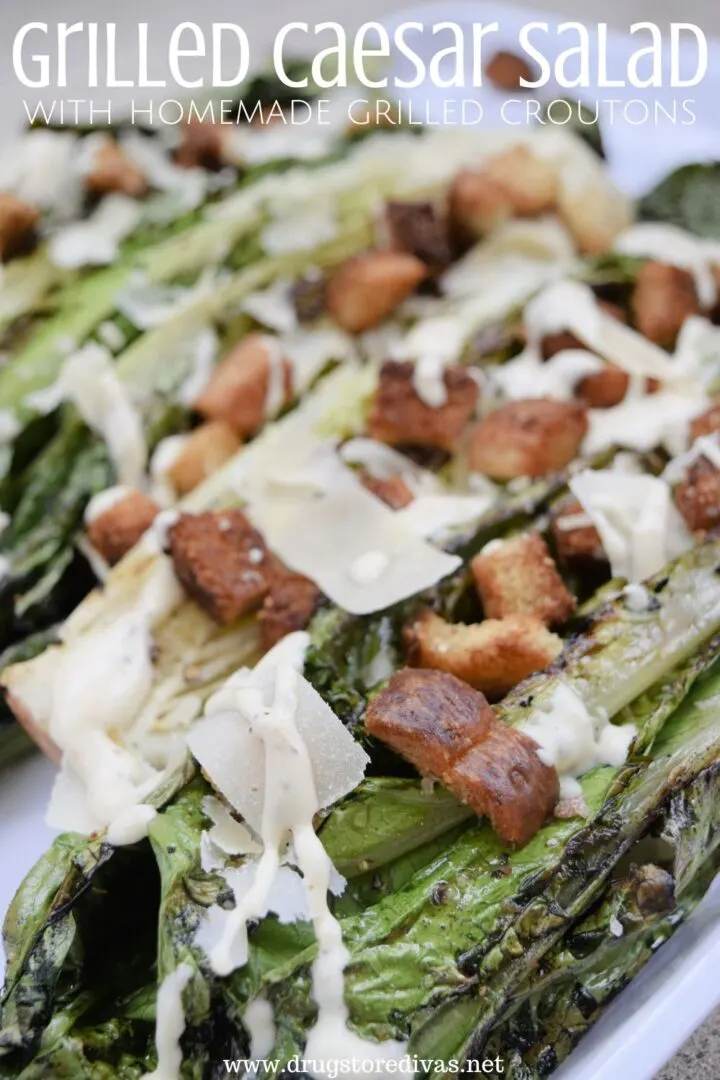 A Grilled Caesar Salad on a white serving plate.