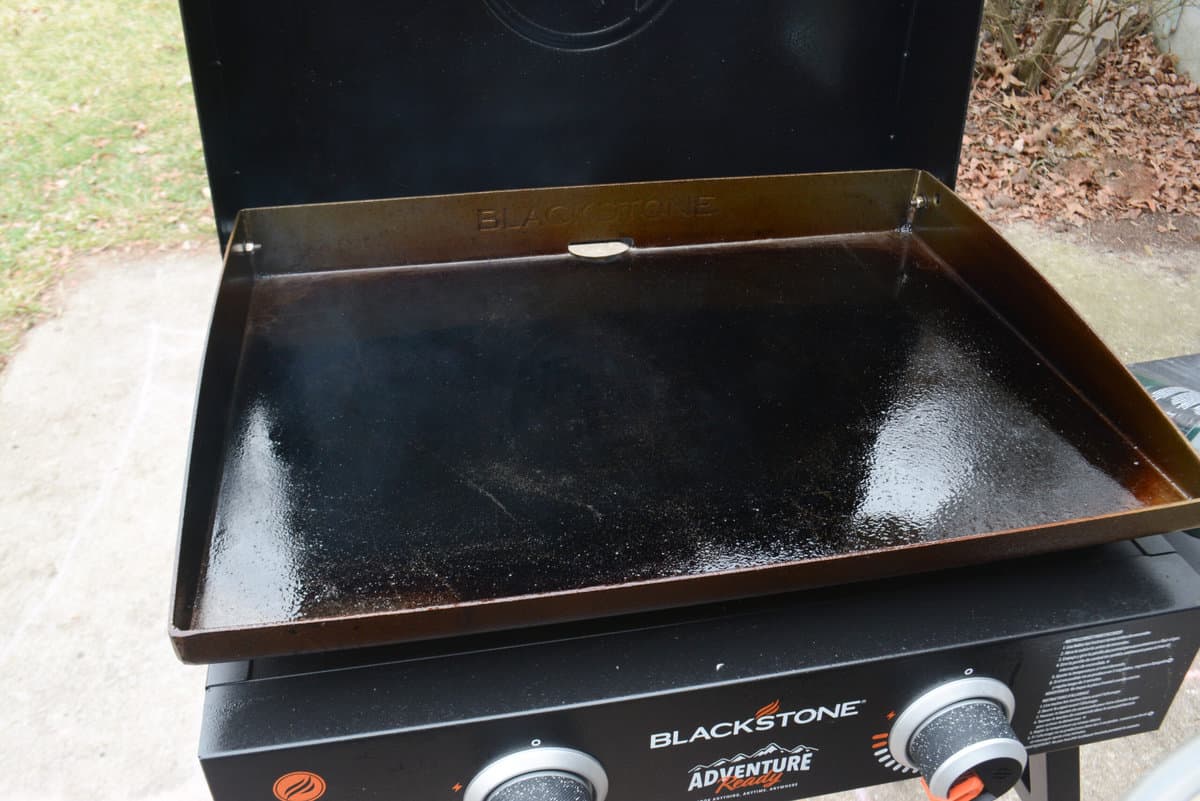 Blackstone griddle with lid open on patio outdoors
