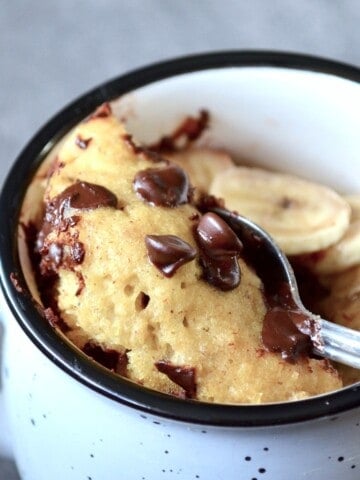 Scooping mug cake with a spoon