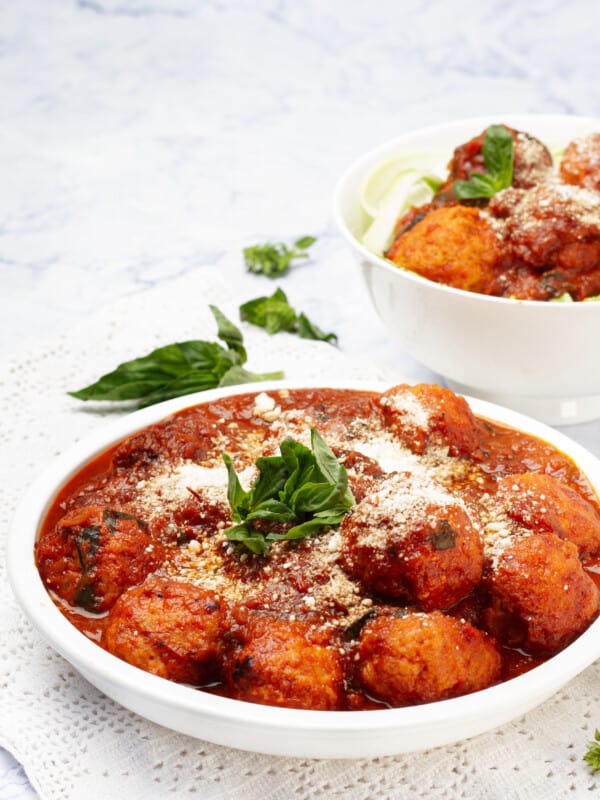Pesto Chicken Meatballs in a bowl and plate