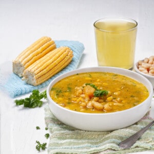 Porotos Granados Soup served in a bowl with beans and corn