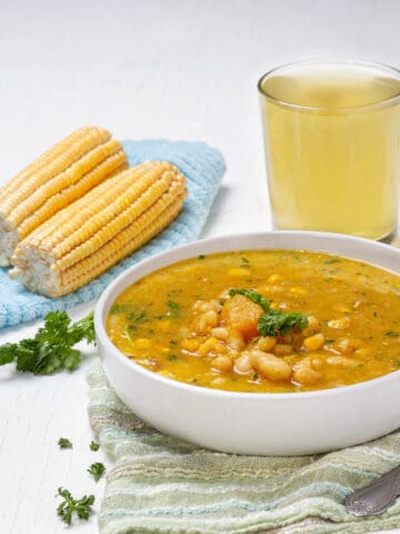 Porotos Granados Soup served in a bowl with beans and corn