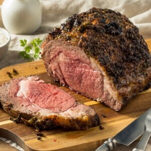 Prime rib perfectly cooked with a cut made out from the end of the steak