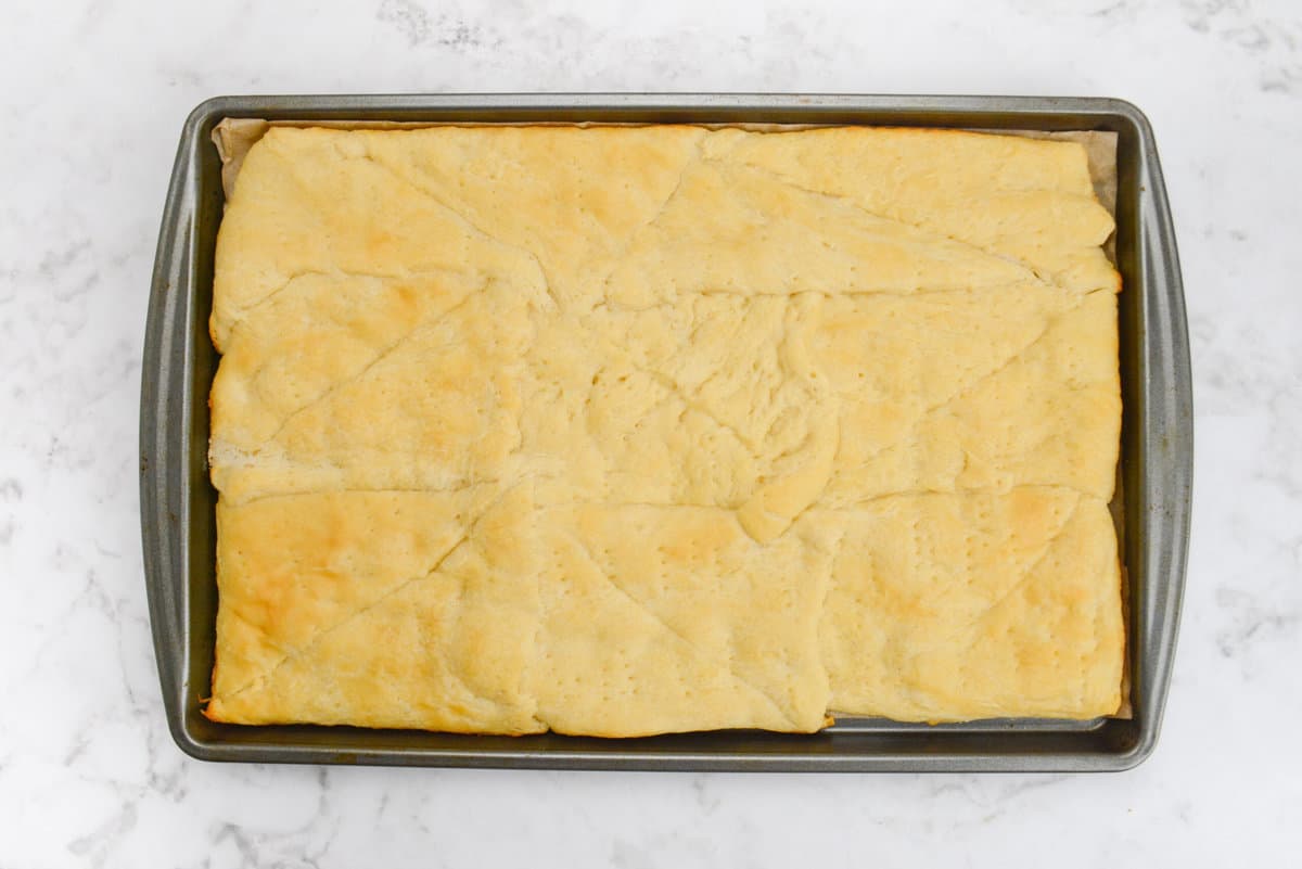 A baking tray with the golden brown baked crust 
