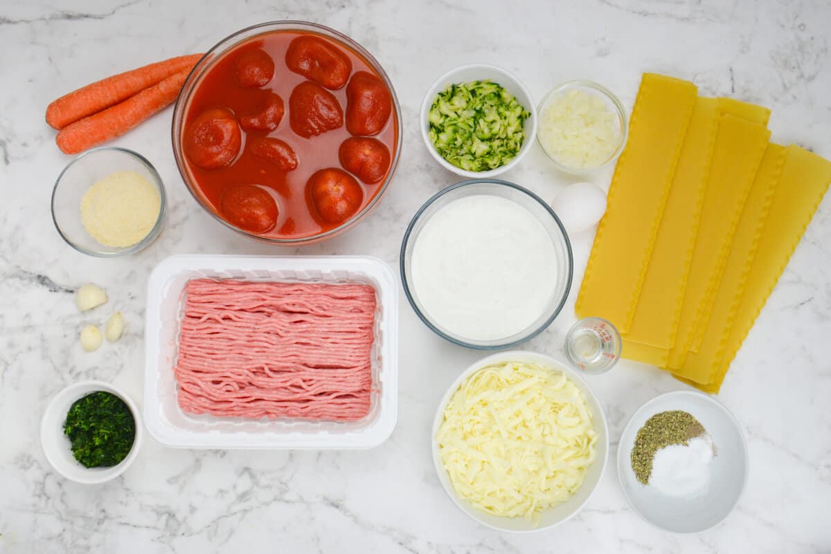 Ingredients needed for Weight Watchers Lasagna shown in various sized bowls 