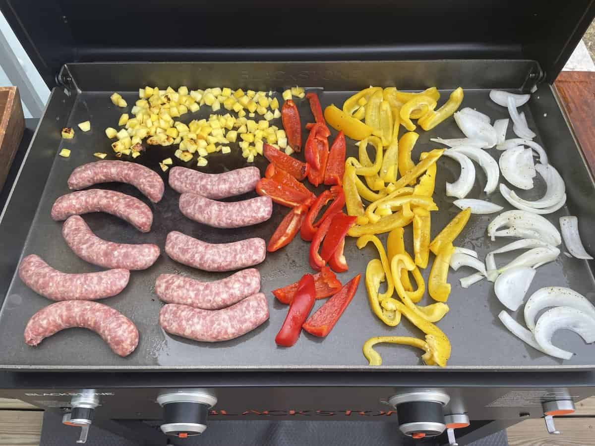 sausages and peppers on a blackstone griddle