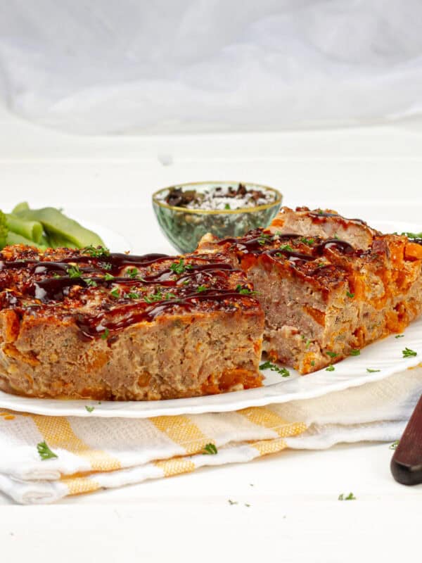 Pork Meatloaf served in a plate with spoon and fork