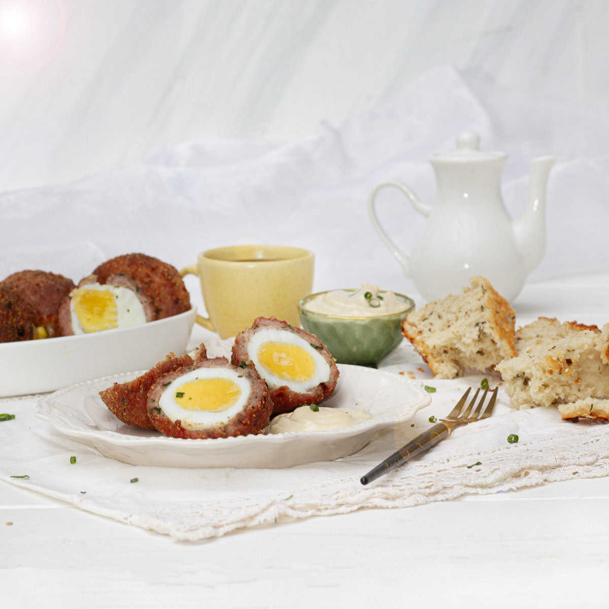 Scotch Eggs beautifully platted on table