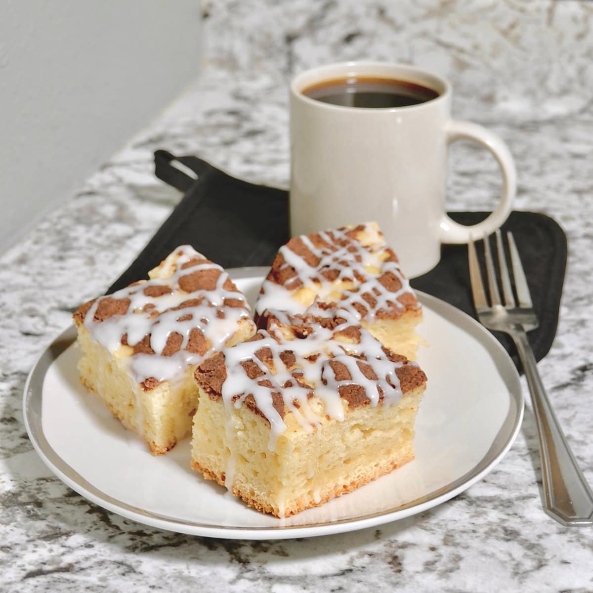 Cup of coffee with cinnamon streusel cake