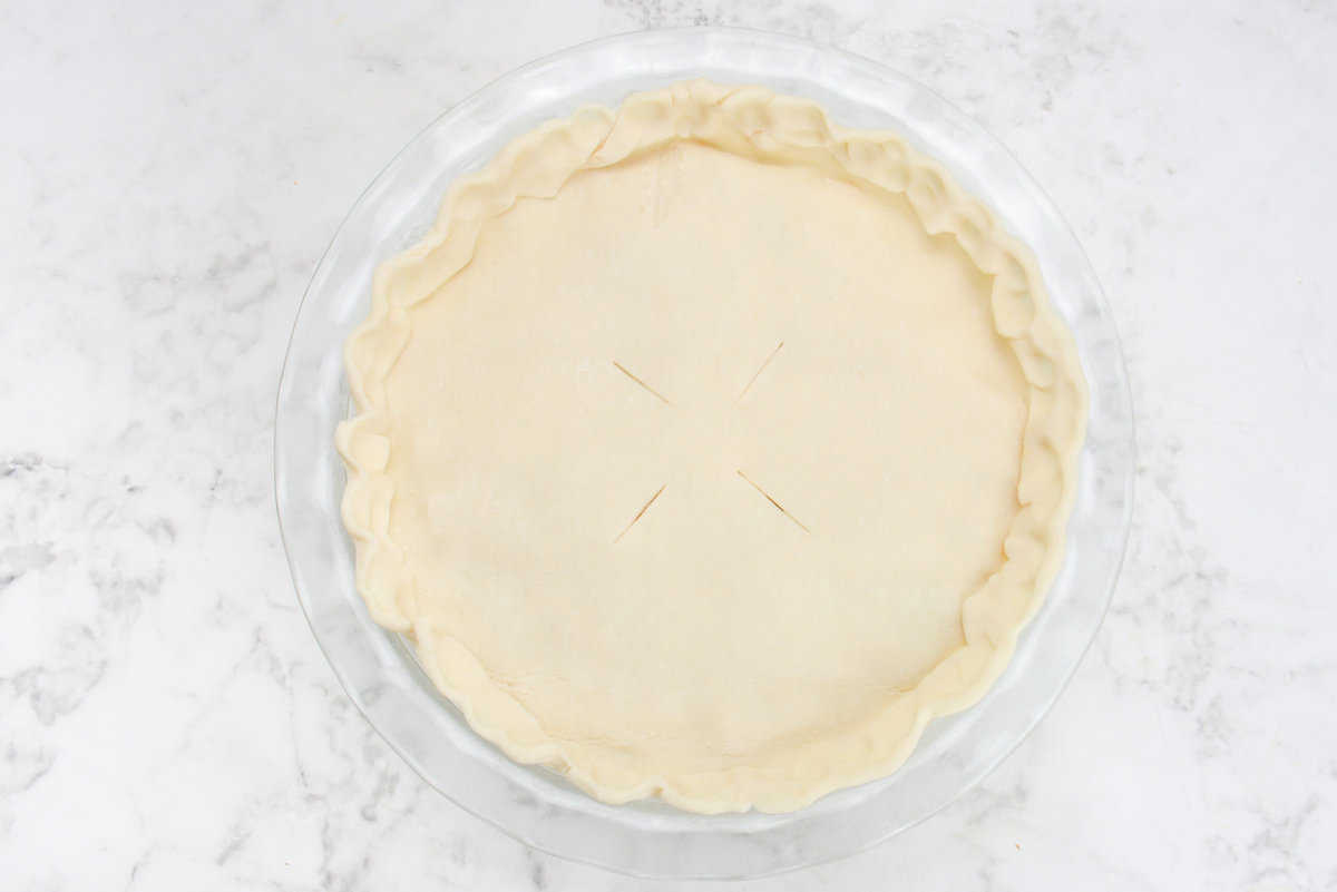 The crimped and vented crust is shown in the clear pie dish 