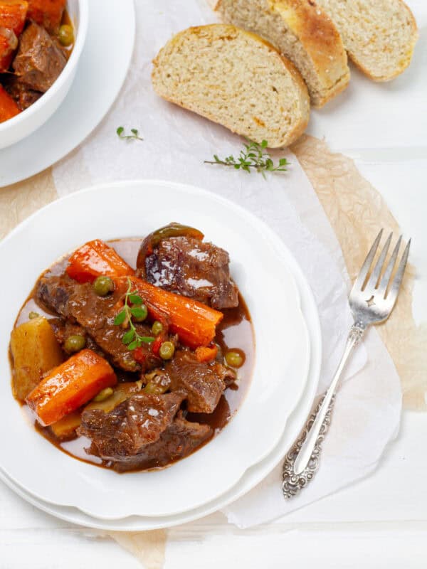 Beef Stew served in a plate with bread