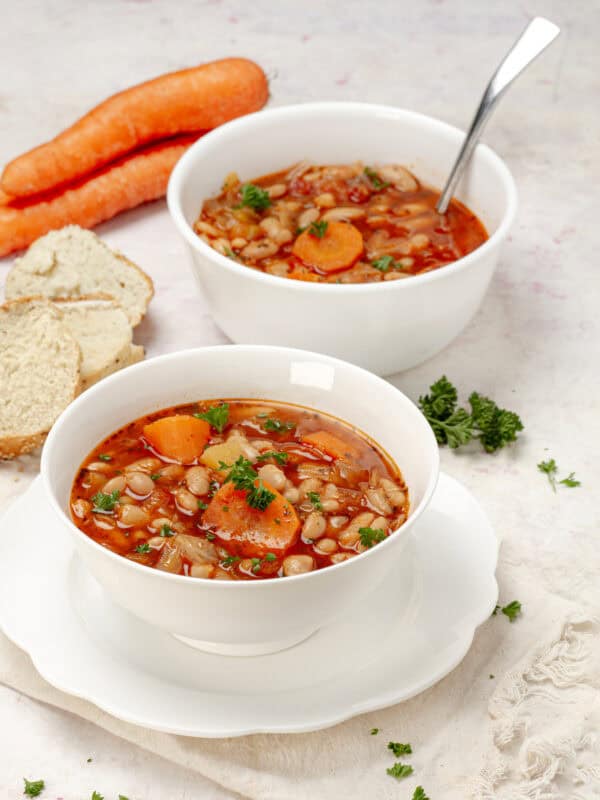 Savory and filling cabbage soup with hearty vegetables and white beans.