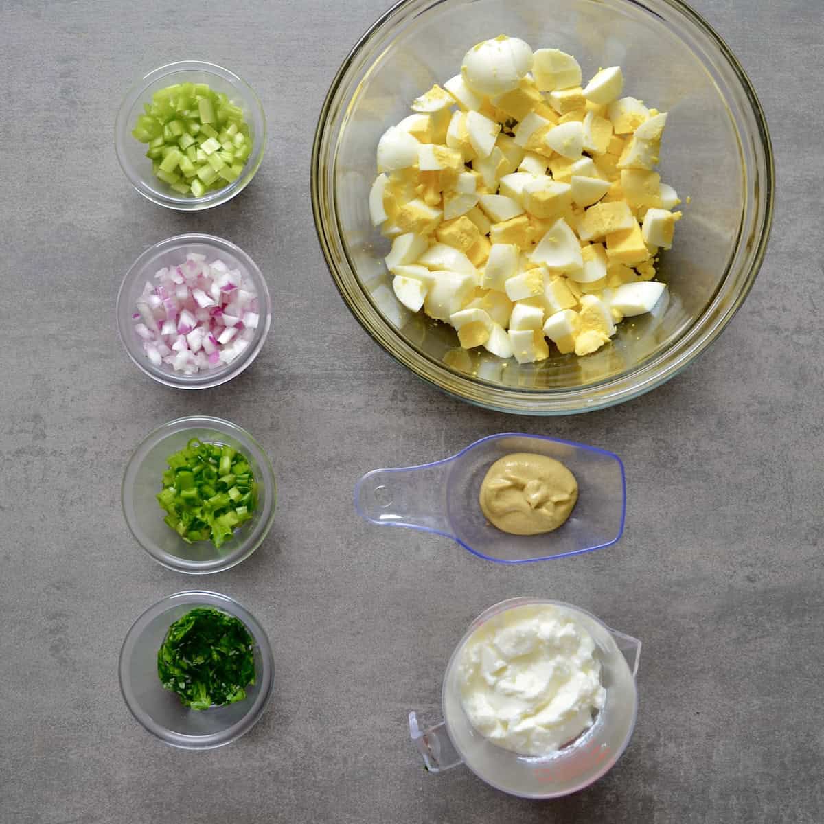 Measured ingredients for making greek yogurt egg salad