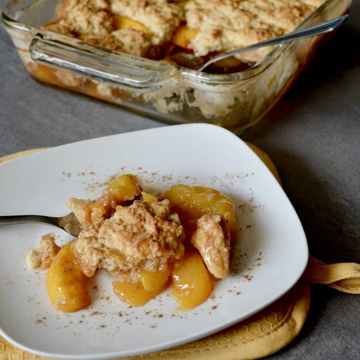 Plated peach cobbler with cinnamon