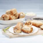 Pork Egg Rolls served in a dish and in backing tray