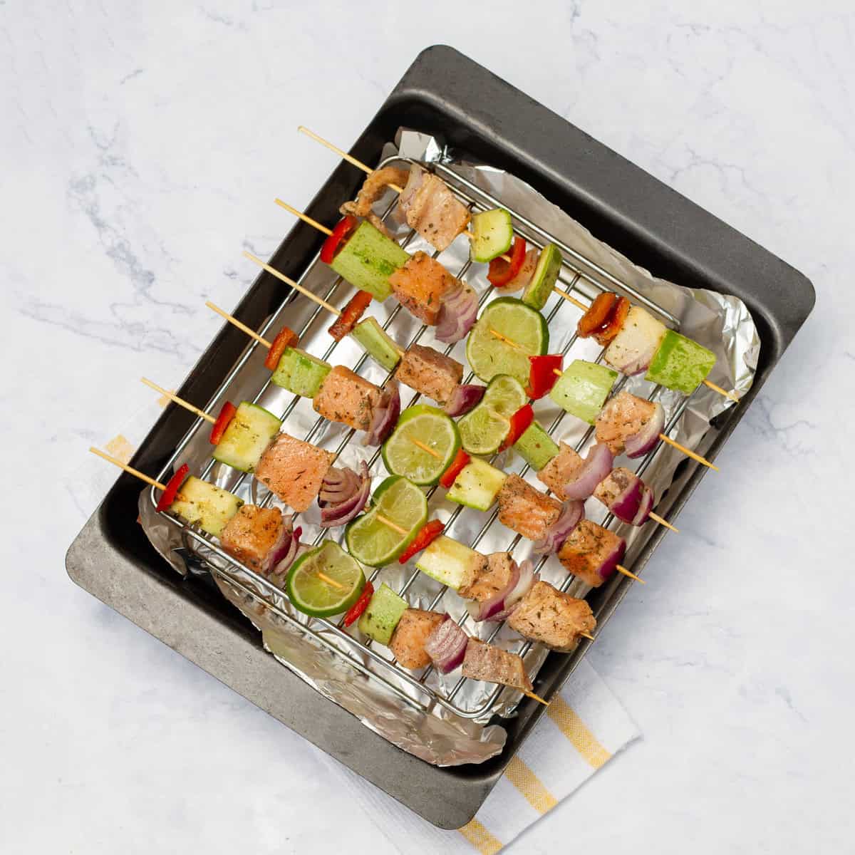 Skewers on backing tray for grilling