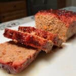 Smoked meatloaf on white plate