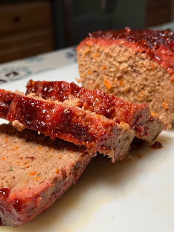 Smoked meatloaf on white plate