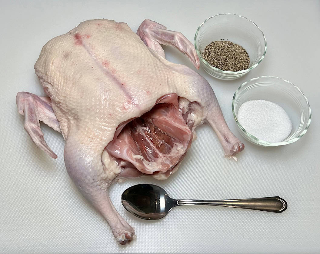 ingredients for smoked duck on white cutting board