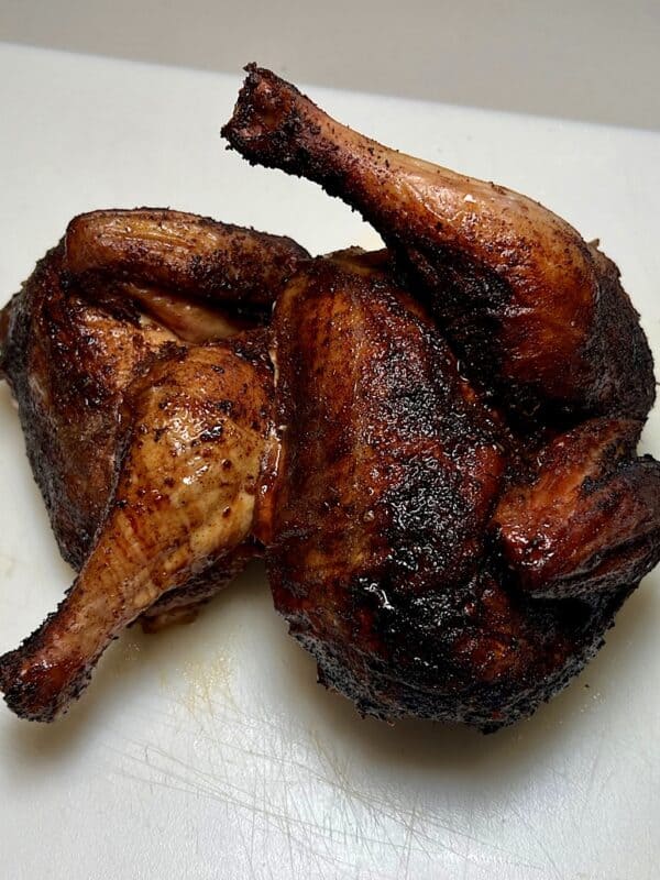finished smoked chicken cut in half