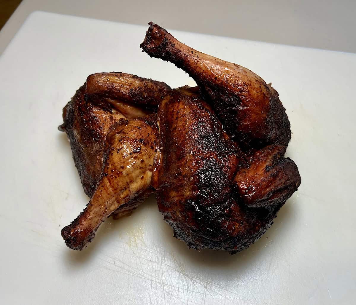finished smoked chicken cut in half