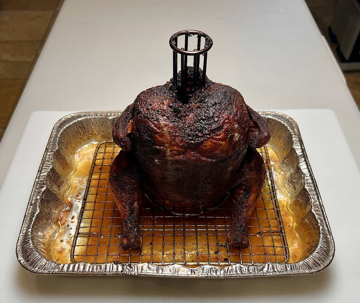 finished smoked chicken in drip pan