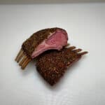 finished rack of lamb sliced in half
