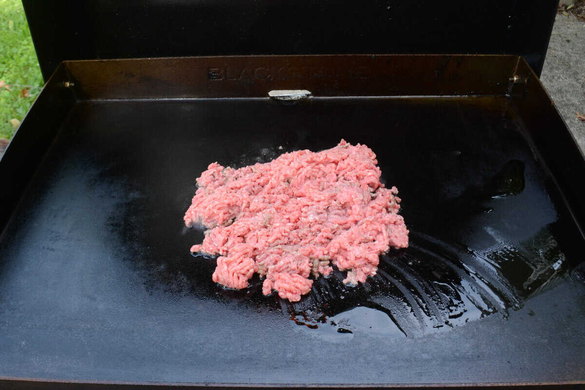 uncooked beef on top of the griddle 