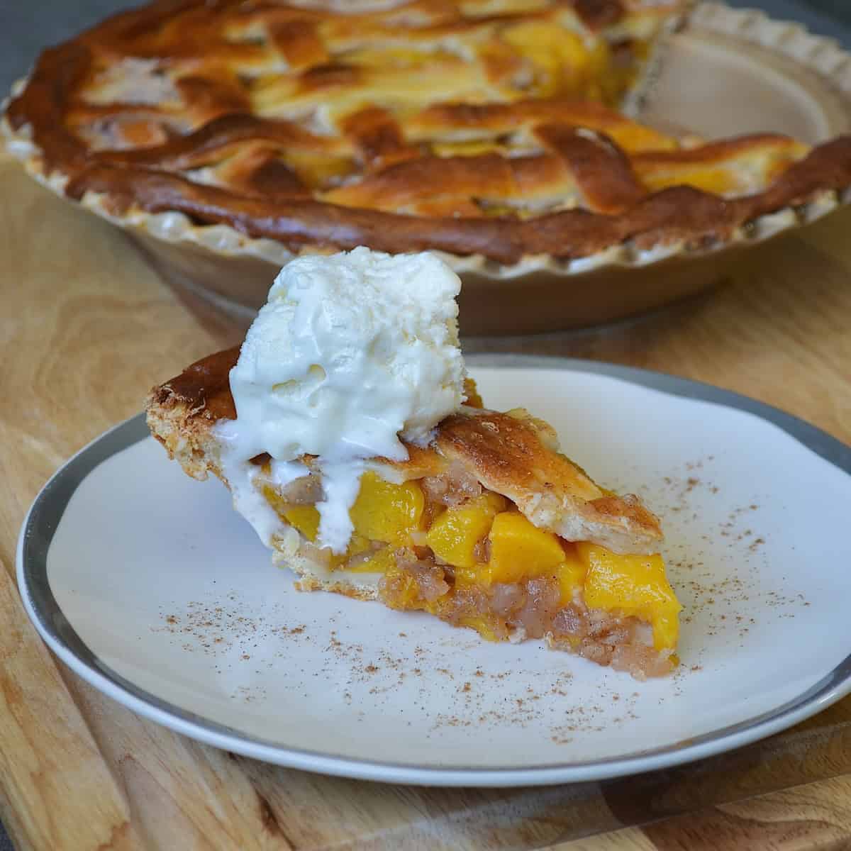 Slice of peach pie with lattice topping