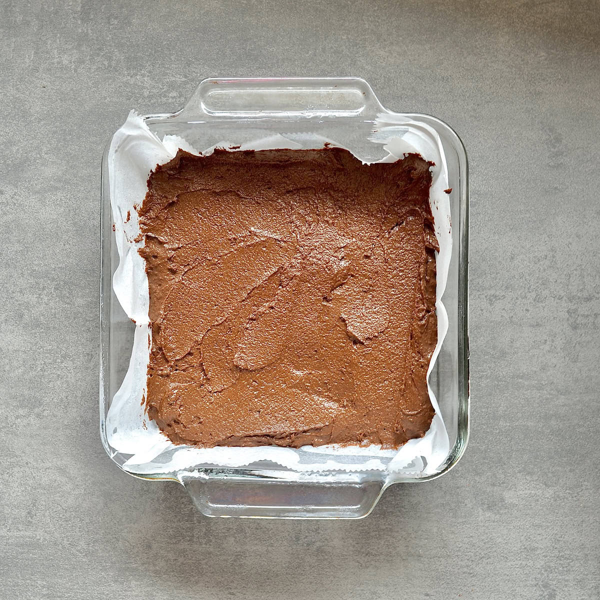 Chocolate brownie batter in a baking dish