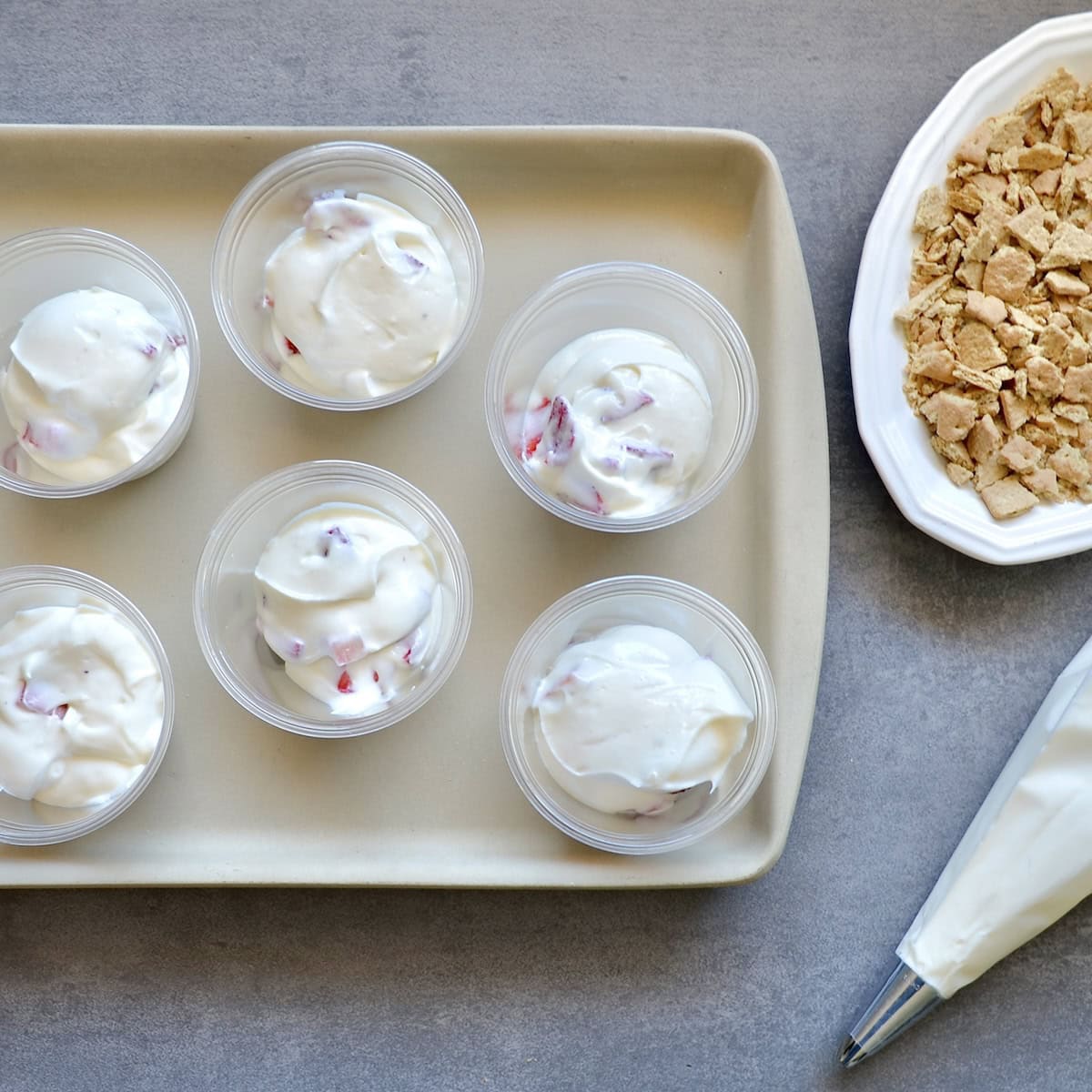 Putting cheesecake fluff into cups