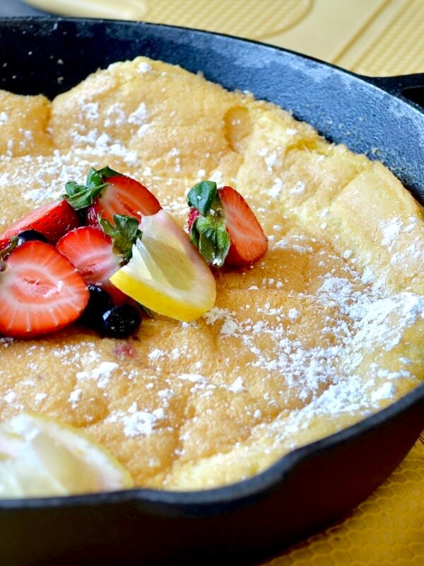 Close up image of a baked dutch baby pancake