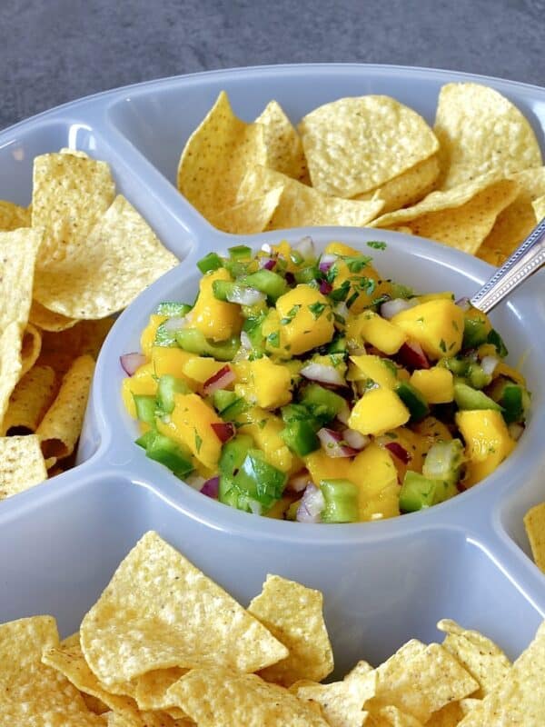 Mango salsa in a chip and dip platter