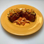filet mignon on yellow plate