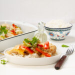 Cheesy Bell Pepper Chicken Casserole on a plate with a fork.