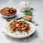 Thick and fragrant Slow Cooker Chicken Pumpkin Curry in a dish over rice.