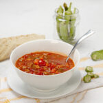 Hearty and nutritions Okra Soup in a bowl with a spoon.