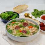 Thick and hearty Portuguese Kale Soup with white beans in a bowl.