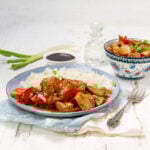 Sweet Hawaiian Crockpot chicken on a plate with rice.