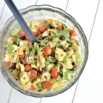 Tortellini salad in a glass bowl